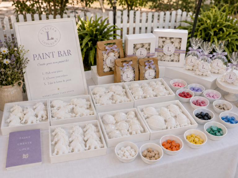 A styled paint bar corner with gypsum pieces, palettes and brushes