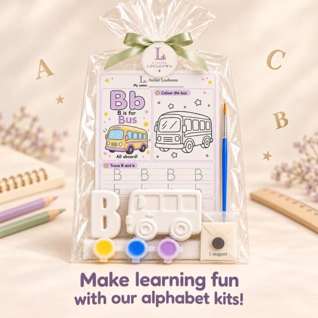The B kit as an example: a gypsum letter B and a gypsum bus, the B is for Bus activity card, three paint pots, a paintbrush and a magnet, in a transparent gift bag tied with a ribbon